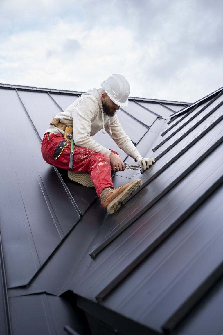 full-shot-man-with-helmet-working-on-roof(1)